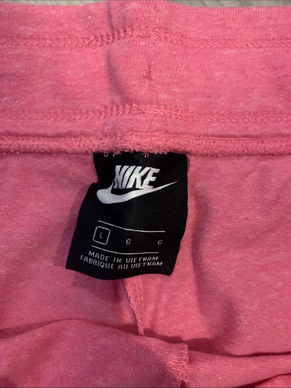 Nike Women's Coral Pink Athletic Shorts with White Trim